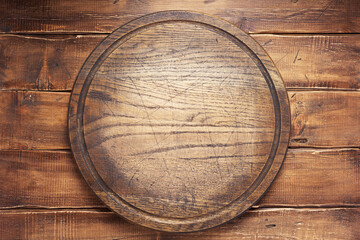 pizza cutting board or tray at wooden background