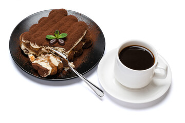 portion of Classic tiramisu dessert and cup of fresh espresso coffee isolated on white background...