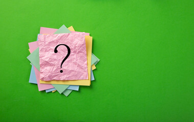 Question mark drawn on notepad.