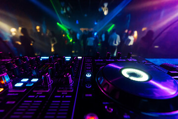Fototapeta na wymiar professional DJ mixer controller for mixing music in a nightclub