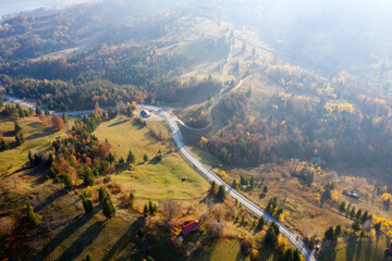 Curvy road in autumn forest.