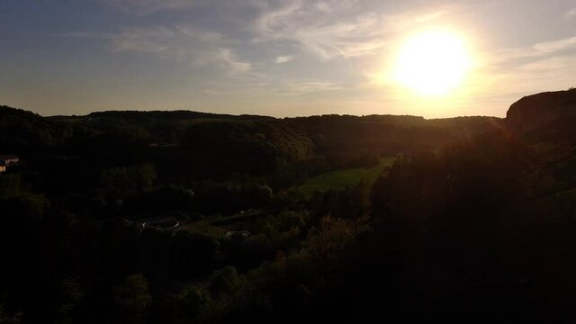 Drone is flying above bavarian hills during sunset