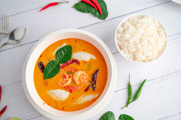 Tom Yum Kung and Fish Balls, Thai food placed on white wooden scene with side dishes.