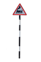 Iron pole with road sign indicating approaching railway crossing on white background