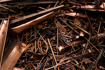 A scrap of old wired and sheet copper material from a recycling company in the purpose of wallpaper and background - obrazy, fototapety, plakaty