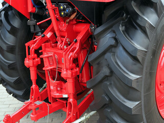 Hydraulic system and hitch of wheeled agricultural tractor.