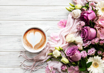 Pink flowers and cup of coffee