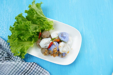Thai steamed rice skin dumplings with vegetables and fresh chili