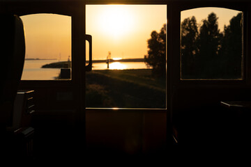 View from the wheelhouse during sunset on a boat trip © fotografiecor