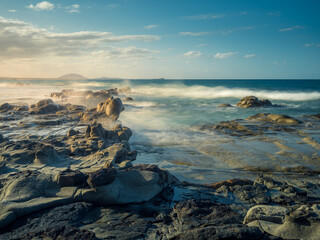 Seascape with Waves Crashing on Rocks in Afternoon Light