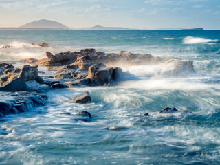 Seascape with Waves Crashing on Rocks in Afternoon Light