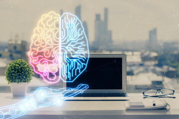 Double exposure of desktop with computer and brain drawing hologram. Artificial intelligence...