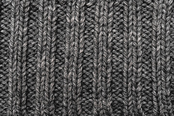 Warm knitted abstract gray  background.