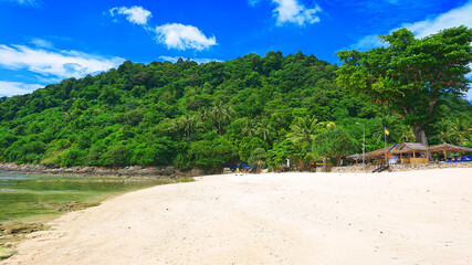 Beautiful Merlin Beach located near Patong in Phuket Island Thailand. View on the jungle, sea, azure water and golden sand.