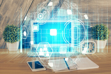 Computer on desktop with social network hologram. Multi exposure. Concept of international people connections.