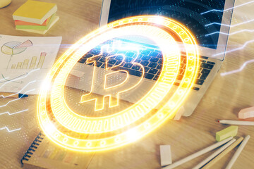 Double exposure of blockchain theme hologram and table with computer background. Concept of bitcoin...