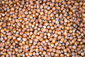 hazelnuts are scattered on the table. Background for design