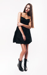 cute teenager with red lips in black dress