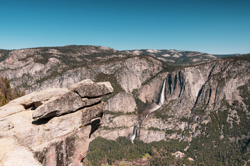 View of Overhanging Rock and Yosemite Falls from Glacier Point view in retro style, Yosemite National Park