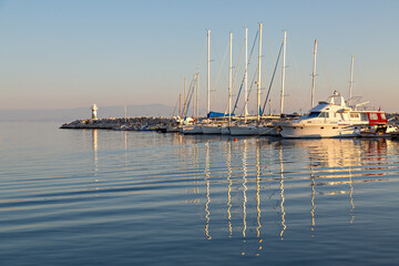 Fototapeta premium Boats in the harbour of the town Kucukkuyu along the Aegean Sea, Turkey