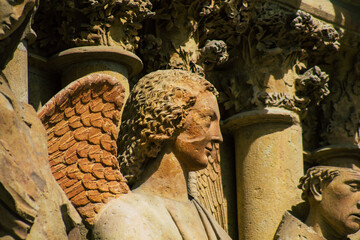 View of the exterior facade of the Roman Catholic Notre Dame de Reims Cathedral, a historical...