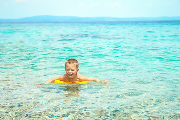 happy child playing at sea in park