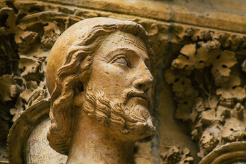 View of the exterior facade of the Roman Catholic Notre Dame de Reims Cathedral, a historical...