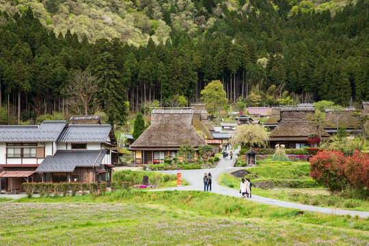 Small groups of tourists in rural Japanese mountain town