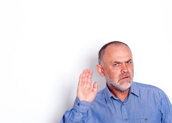 Obraz premium the man in blue shirt putting his hand near his ear on white background