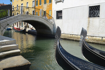 
glimpses of Venetian palaces with canals, bridges and typical gondolas