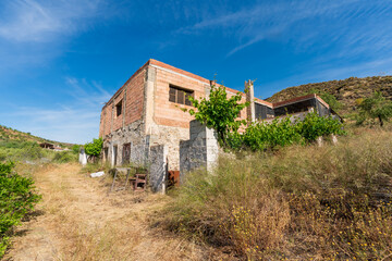 Fototapeta na wymiar Old brick and stone farmhouse in southern Spain