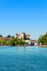 Fototapeta na wymiar Lake Annecy, a view of the Duingt Castle (Château de Duingt) and the surrounding French Alps. France