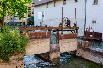 Fototapeta na wymiar Ancient sluices in the town of Annecy. France