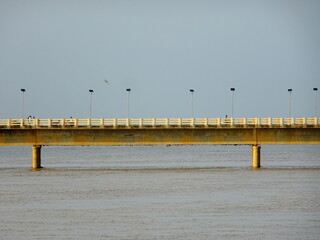 Old bridge standing on river filled with water in Bhubaneswar