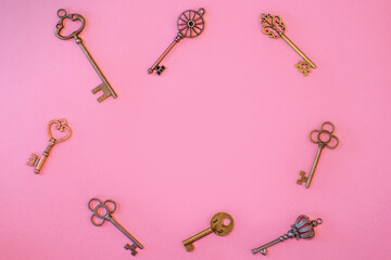 Many different old keys from different locks, scattered chaotically, flat lay.