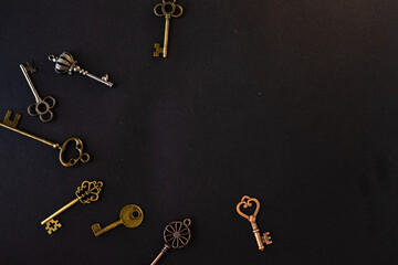 Fototapeta na wymiar Many different old keys from different locks, scattered chaotically, flat lay.