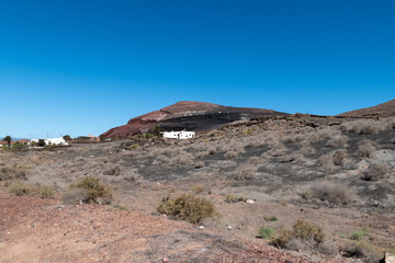 view of houses in volcanic area on the island of lanzarote, canary islands,