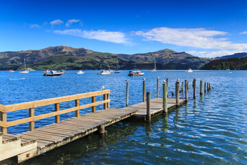 A multi-level wharf at Akaroa, New Zealand, allowing boats to dock easily at both high and low tide