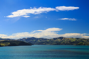 Fototapeta premium The hills of Banks Peninsula, New Zealand, as viewed from Akaroa Harbour