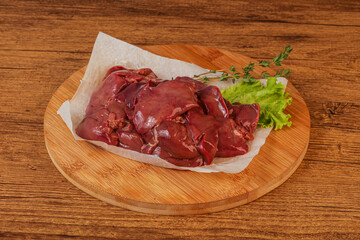 Raw chicken liver over board