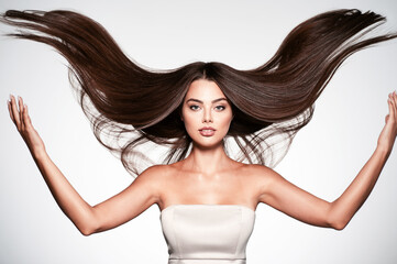 Portrait of a beautiful woman with a long straight hair.