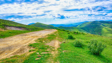 Fototapeta na wymiar Passing motor road on the slope of the Caucasus Mountains