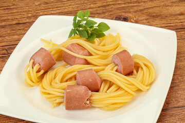 Kids pasta spaghetti with sausages
