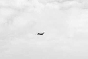 passenger plane in a cloudy sky