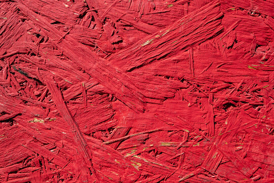 texture of an old red-painted wood slab