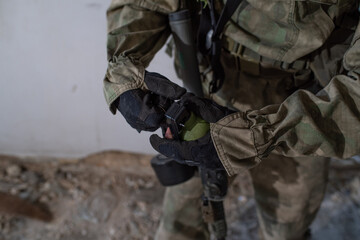 Close-up grenade in the hands of an airsoft player