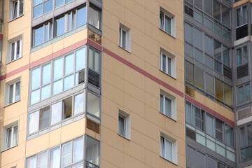 Windows of a multi-storey residential building close-up