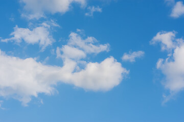Heart of clouds. Snow-white clouds in a blue sky. A symbol of love and unity. Beautiful abstract natural background.