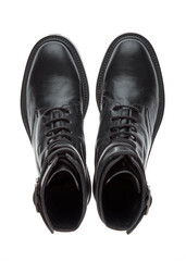 Black biker boots made of durable leather with a small heel, isolated on a white background with a shadow. Top view.