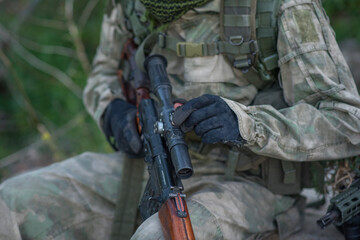 The sniper adjusts his sight to the SVD. Airsoft game